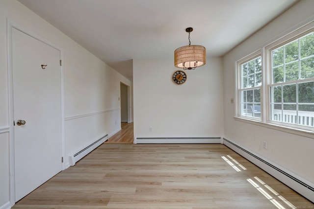 64 Regina St, Trumbull, CT 06611 - empty room featuring a baseboard radiator and light wood finished floors