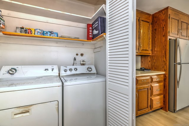 64 Regina St, Trumbull, CT 06611 - laundry area featuring washer and clothes dryer and light wood-type flooring