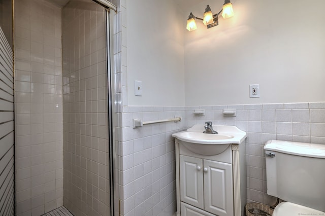 64 Regina St, Trumbull, CT 06611 - bathroom featuring tile walls, vanity, tiled shower, toilet, and a wainscoted wall