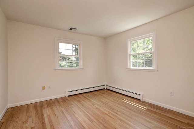 64 Regina St, Trumbull, CT 06611 - empty room with healthy amount of natural light, wood finished floors, and baseboards