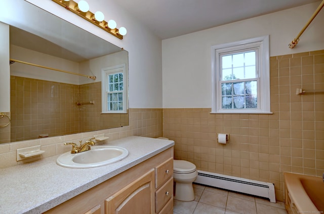 64 Regina St, Trumbull, CT 06611 - bathroom featuring a baseboard heating unit, tile walls, tile patterned flooring, healthy amount of natural light, and vanity