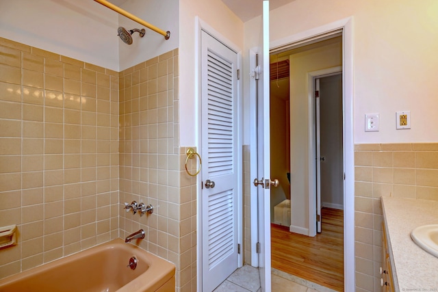 64 Regina St, Trumbull, CT 06611 - full bathroom featuring vanity, bathing tub / shower combination, tile patterned floors, and tile walls