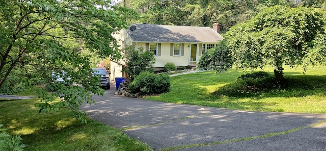 33 Bristol Dr, Canton, CT 06019 - view of front of house with a chimney, a front lawn, and asphalt driveway