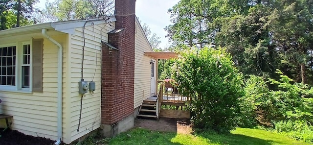 33 Bristol Dr, Canton, CT 06019 - view of side of home featuring a chimney and a wooden deck