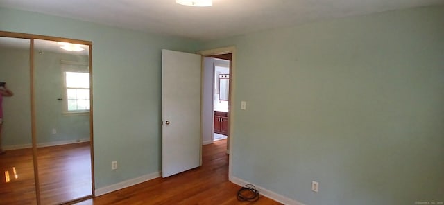 33 Bristol Dr, Canton, CT 06019 - unfurnished bedroom with wood finished floors and baseboards