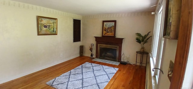 33 Bristol Dr, Canton, CT 06019 - living area with a fireplace with flush hearth, wood finished floors, and baseboards