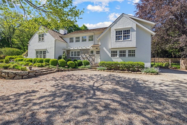 6 Over Rock Ln, Westport, CT 06880 - view of front of home with a chimney and gravel driveway