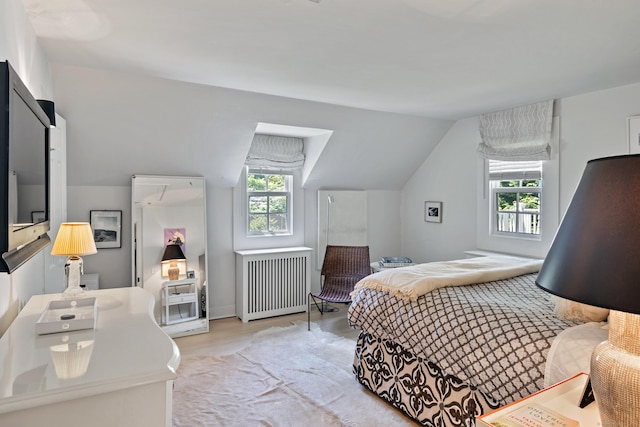 6 Over Rock Ln, Westport, CT 06880 - bedroom with radiator, multiple windows, vaulted ceiling, and light wood finished floors