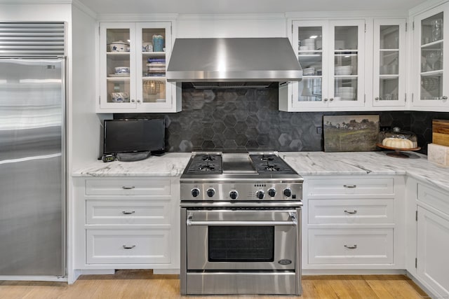 6 Over Rock Ln, Westport, CT 06880 - kitchen with premium appliances, island exhaust hood, and white cabinets