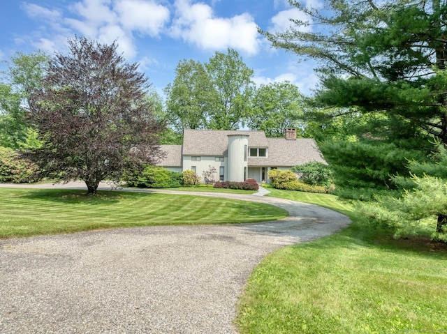 76 Farview Farm Rd, Redding, CT 06896 - mid-century modern home with a chimney, a front lawn, and curved driveway