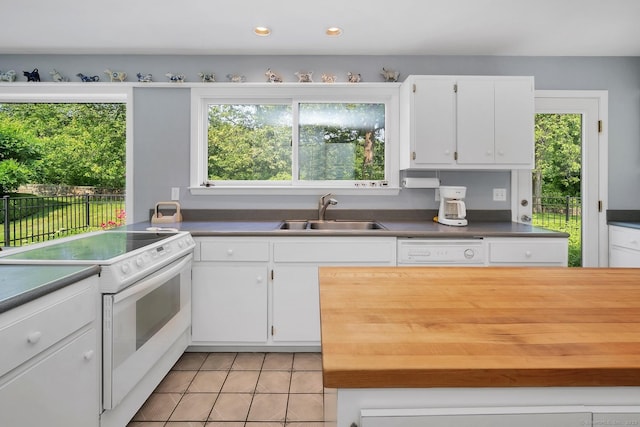 76 Farview Farm Rd, Redding, CT 06896 - kitchen featuring white appliances, light tile patterned floors, white cabinets, dark countertops, and recessed lighting