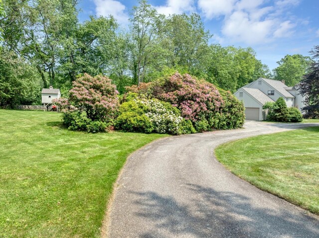 76 Farview Farm Rd, Redding, CT 06896 - view of front of house with driveway, a front lawn, and an attached garage