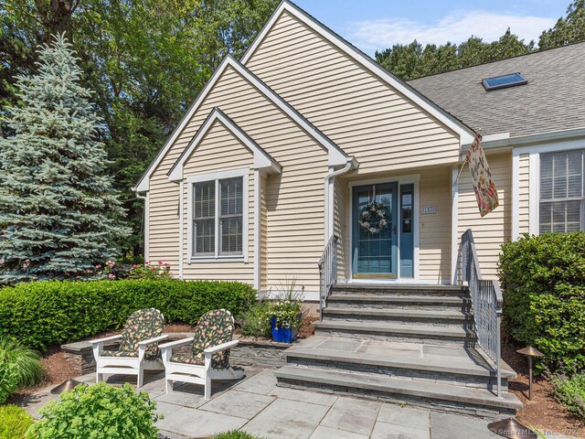 152 Hollyberry Rd, Bristol, CT 06010 - entrance to property with a patio area and roof with shingles