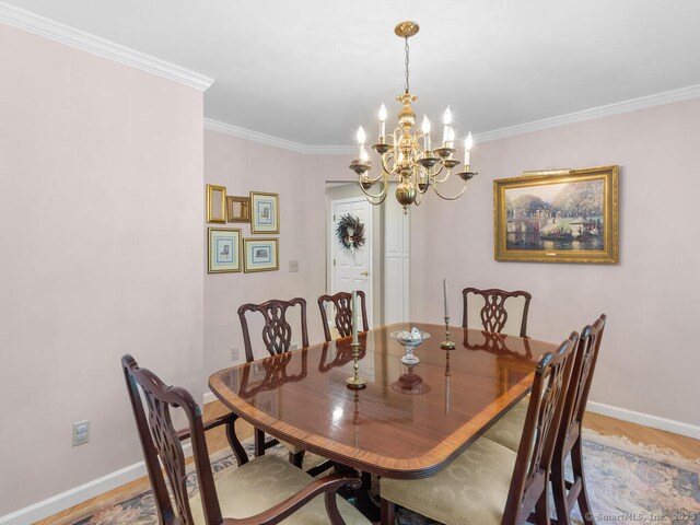 152 Hollyberry Rd, Bristol, CT 06010 - dining area featuring ornamental molding and a chandelier