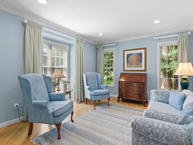 152 Hollyberry Rd, Bristol, CT 06010 - living area featuring crown molding, healthy amount of natural light, light wood-style flooring, and recessed lighting