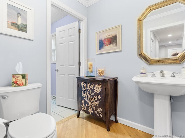 152 Hollyberry Rd, Bristol, CT 06010 - bathroom featuring ornamental molding and wood finished floors
