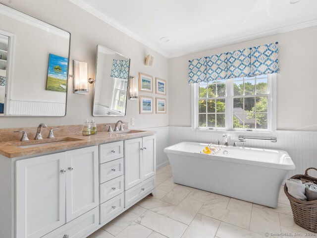 152 Hollyberry Rd, Bristol, CT 06010 - full bath featuring a wainscoted wall, a freestanding tub, double vanity, marble finish floors, and crown molding