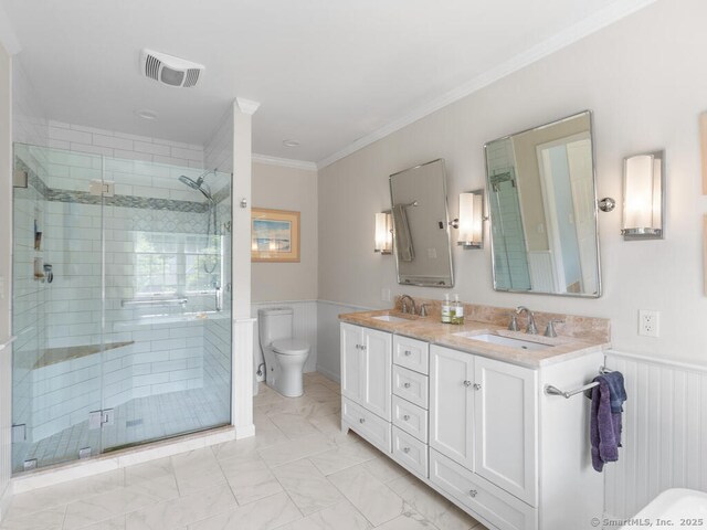 152 Hollyberry Rd, Bristol, CT 06010 - full bathroom featuring double vanity, a stall shower, wainscoting, ornamental molding, and marble finish floors