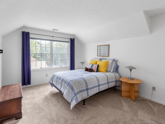 152 Hollyberry Rd, Bristol, CT 06010 - carpeted bedroom with vaulted ceiling and a textured ceiling