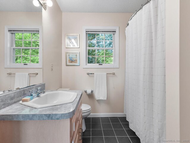 152 Hollyberry Rd, Bristol, CT 06010 - bathroom with vanity, tile patterned floors, a textured ceiling, and a shower with curtain