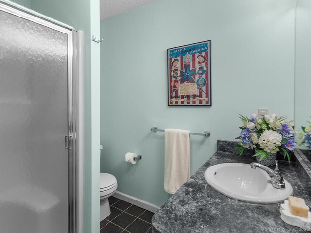 152 Hollyberry Rd, Bristol, CT 06010 - bathroom with a shower stall, tile patterned floors, vanity, and a textured ceiling