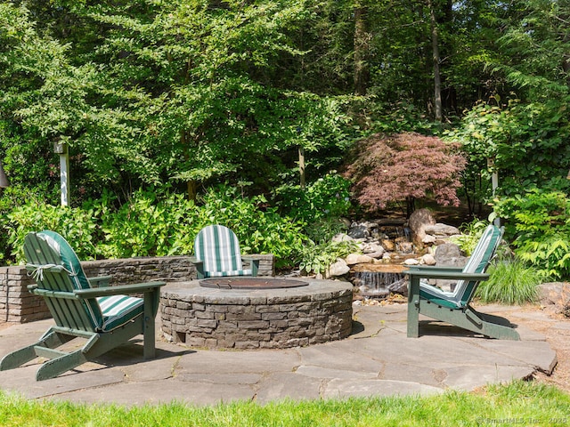 152 Hollyberry Rd, Bristol, CT 06010 - view of patio featuring an outdoor fire pit