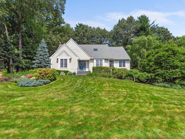 152 Hollyberry Rd, Bristol, CT 06010 - ranch-style home with a chimney and a front lawn