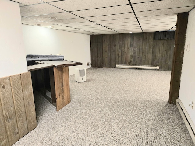 7 Bayberry Ct Unit 7, Cromwell, CT 06416 - finished below grade area featuring baseboard heating, carpet flooring, wood walls, a baseboard radiator, and a drop ceiling