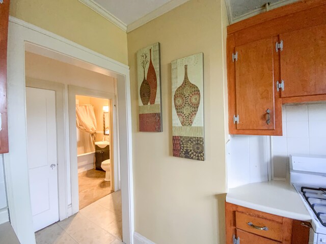 240 Martin St, Hartford, CT 06120 - hallway with ornamental molding and light tile patterned flooring