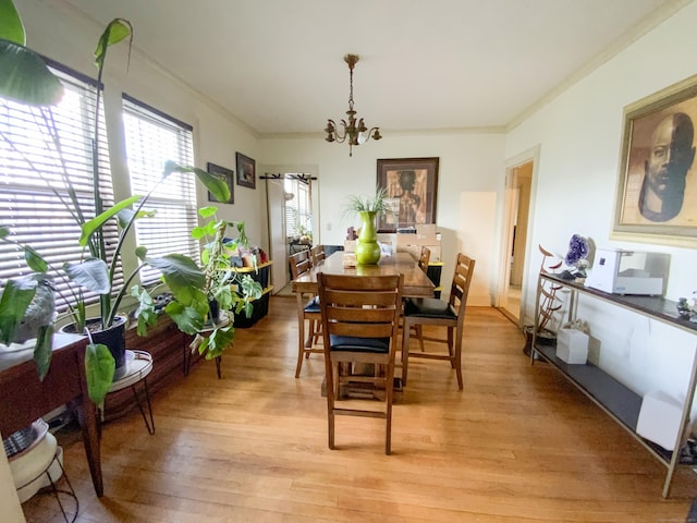240 Martin St, Hartford, CT 06120 - dining area with a chandelier, ornamental molding, and light wood-type flooring