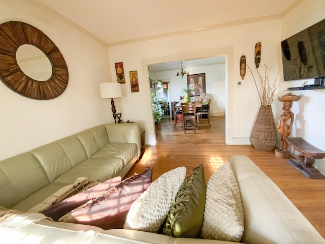 240 Martin St, Hartford, CT 06120 - living room with wood finished floors, a chandelier, crown molding, and baseboards