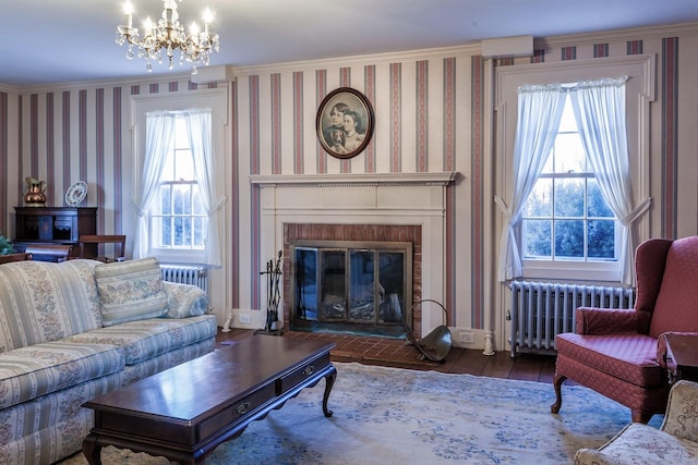 163 Lake Rd, Warren, CT 06754 - living room with radiator heating unit, hardwood / wood-style flooring, wallpapered walls, a chandelier, and plenty of natural light