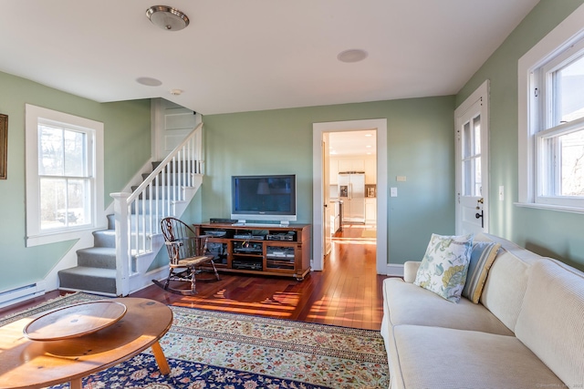 163 Lake Rd, Warren, CT 06754 - living room with wood finished floors, stairs, baseboards, and baseboard heating