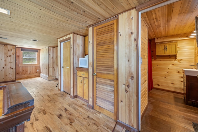 46 Bellamy Ln, Bethlehem, CT 06751 - corridor featuring wooden ceiling, light wood finished floors, and wooden walls