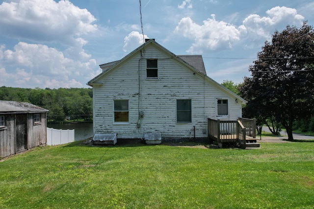 46 Bellamy Ln, Bethlehem, CT 06751 - rear view of house with a lawn and a deck with water view