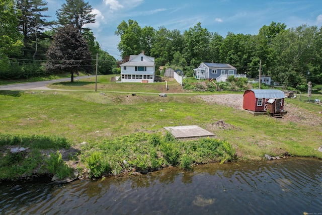 46 Bellamy Ln, Bethlehem, CT 06751 - rear view of house featuring a shed, a lawn, and a water view