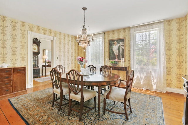 19 Skymeadow Dr, Stamford, CT 06903 - dining area featuring wallpapered walls, light wood finished floors, a chandelier, and plenty of natural light