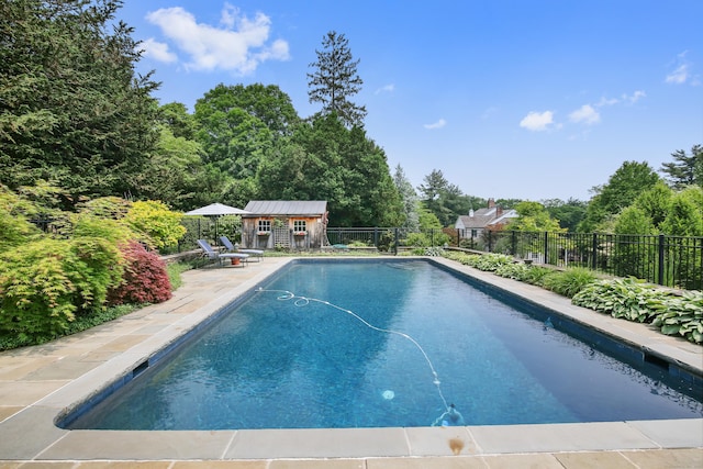19 Skymeadow Dr, Stamford, CT 06903 - view of swimming pool featuring an outdoor structure and a patio