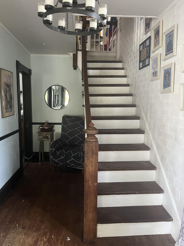 66 S 3rd St, Meriden, CT 06451 - stairway featuring hardwood / wood-style flooring, ornamental molding, brick wall, and baseboards