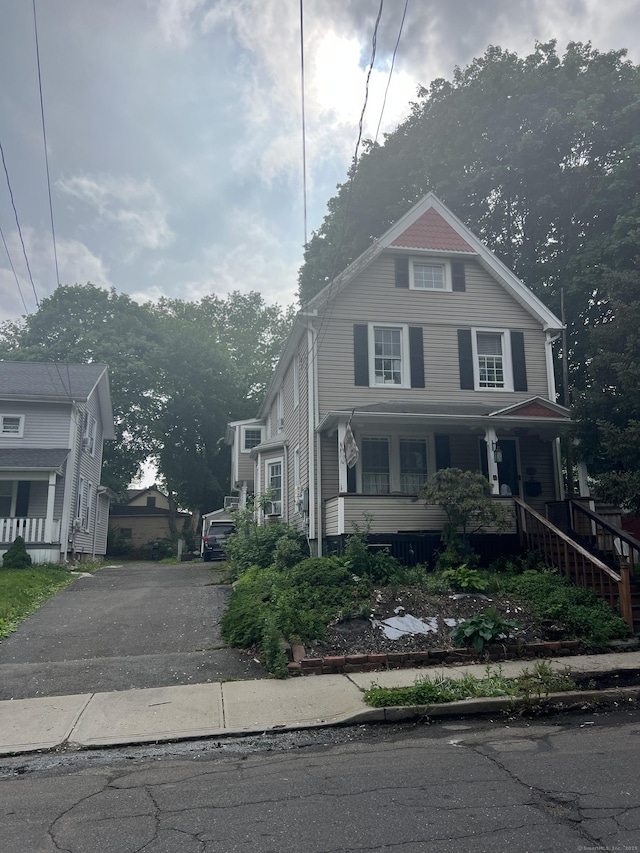 66 S 3rd St, Meriden, CT 06451 - american foursquare style home with covered porch, driveway, and stairs