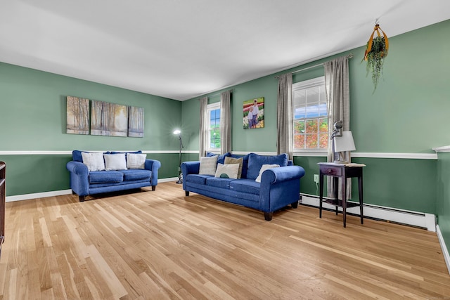 25 Meadow Dr, Ledyard, CT 06335 - living room with wood finished floors, a baseboard radiator, and baseboards