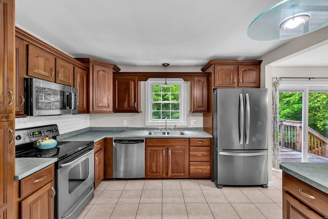 25 Meadow Dr, Ledyard, CT 06335 - kitchen featuring stainless steel appliances, a sink, healthy amount of natural light, and backsplash