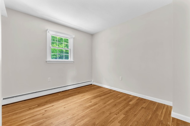 25 Meadow Dr, Ledyard, CT 06335 - empty room featuring a baseboard radiator, light wood-style floors, and baseboards
