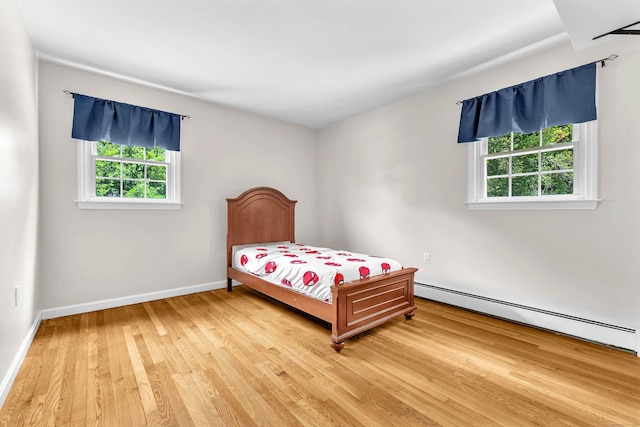 25 Meadow Dr, Ledyard, CT 06335 - bedroom featuring multiple windows, light wood-style flooring, baseboard heating, and baseboards