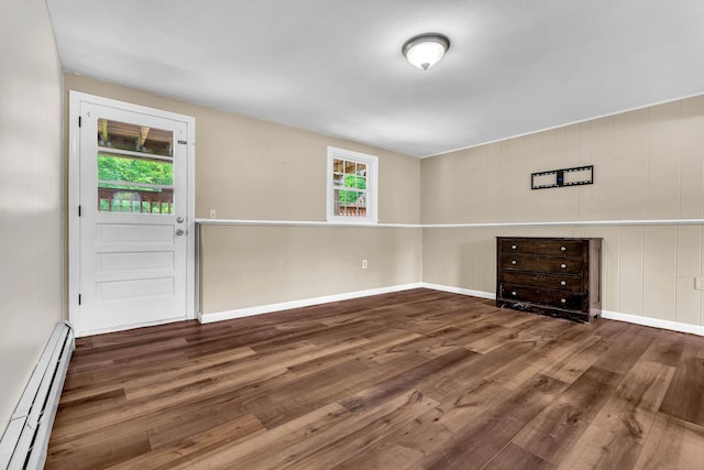25 Meadow Dr, Ledyard, CT 06335 - empty room with baseboard heating, wood finished floors, and baseboards