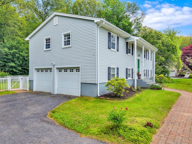 25 Meadow Dr, Ledyard, CT 06335 - view of property exterior featuring asphalt driveway and a garage