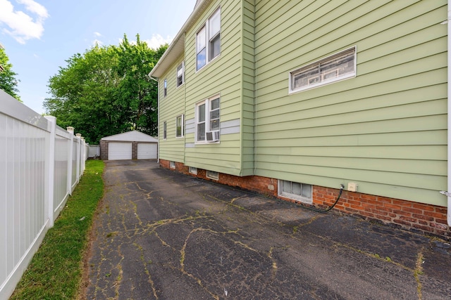 98 Gorham Ave, Hamden, CT 06514 - view of side of home featuring a garage and an outdoor structure