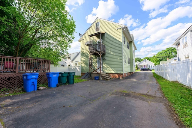 98 Gorham Ave, Hamden, CT 06514 - rear view of house with a balcony and driveway