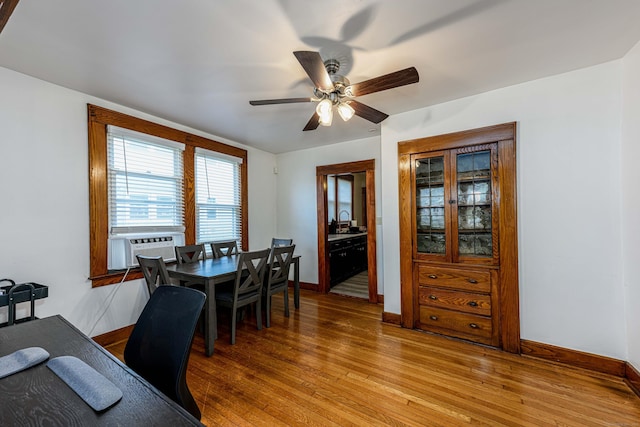 98 Gorham Ave, Hamden, CT 06514 - dining space with baseboards, light wood-style flooring, a ceiling fan, cooling unit, and a desk