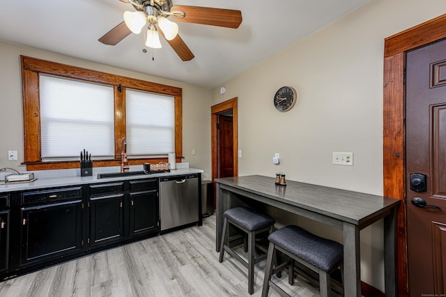 98 Gorham Ave, Hamden, CT 06514 - kitchen with dishwasher, dark cabinets, a sink, light wood-style floors, and ceiling fan